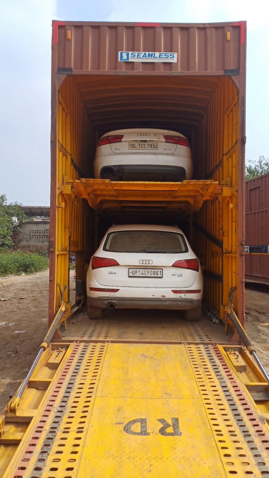 Audi SUV secured inside an enclosed car carrier for intercity transport