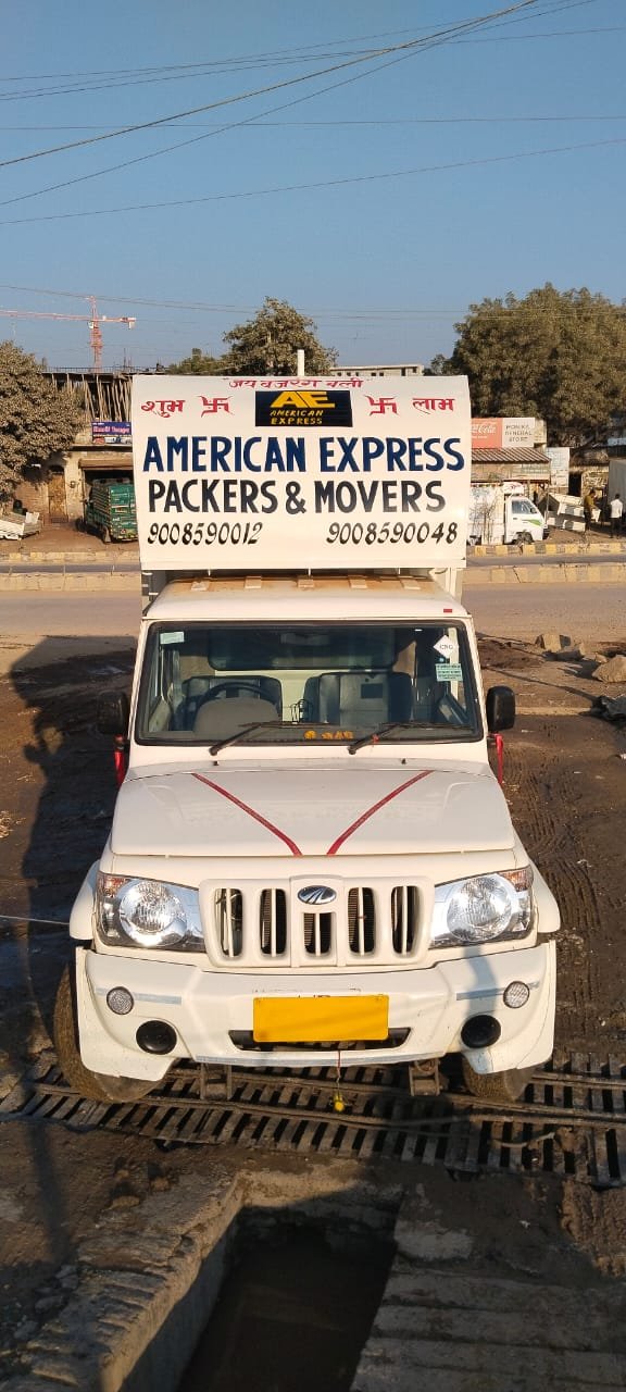 American Express Packers and Movers branded moving truck with contact numbers
