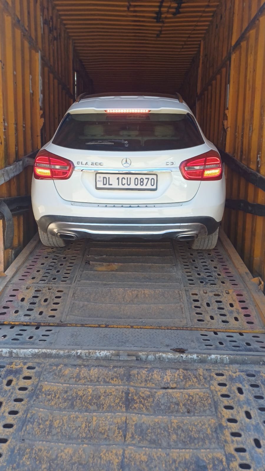 Mercedes SUV secured in an enclosed container for damage-free car transport